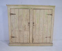 A large painted pine two door cupboard - one piece of cornice missing - length 187cm, depth 80cm,