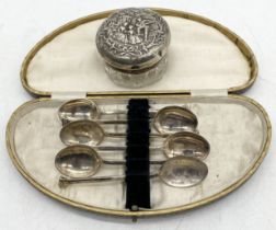 A set of silver plated coffee spoons along with a continental silver topped dressing table pot