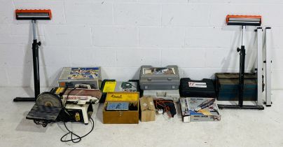 A collection of various power tools including a Black & Decker circular saw, Axminster Tools sheet