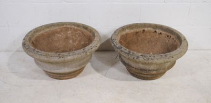 A pair of large circular reconstituted stone garden urns - diameter 61cm, height 30cm