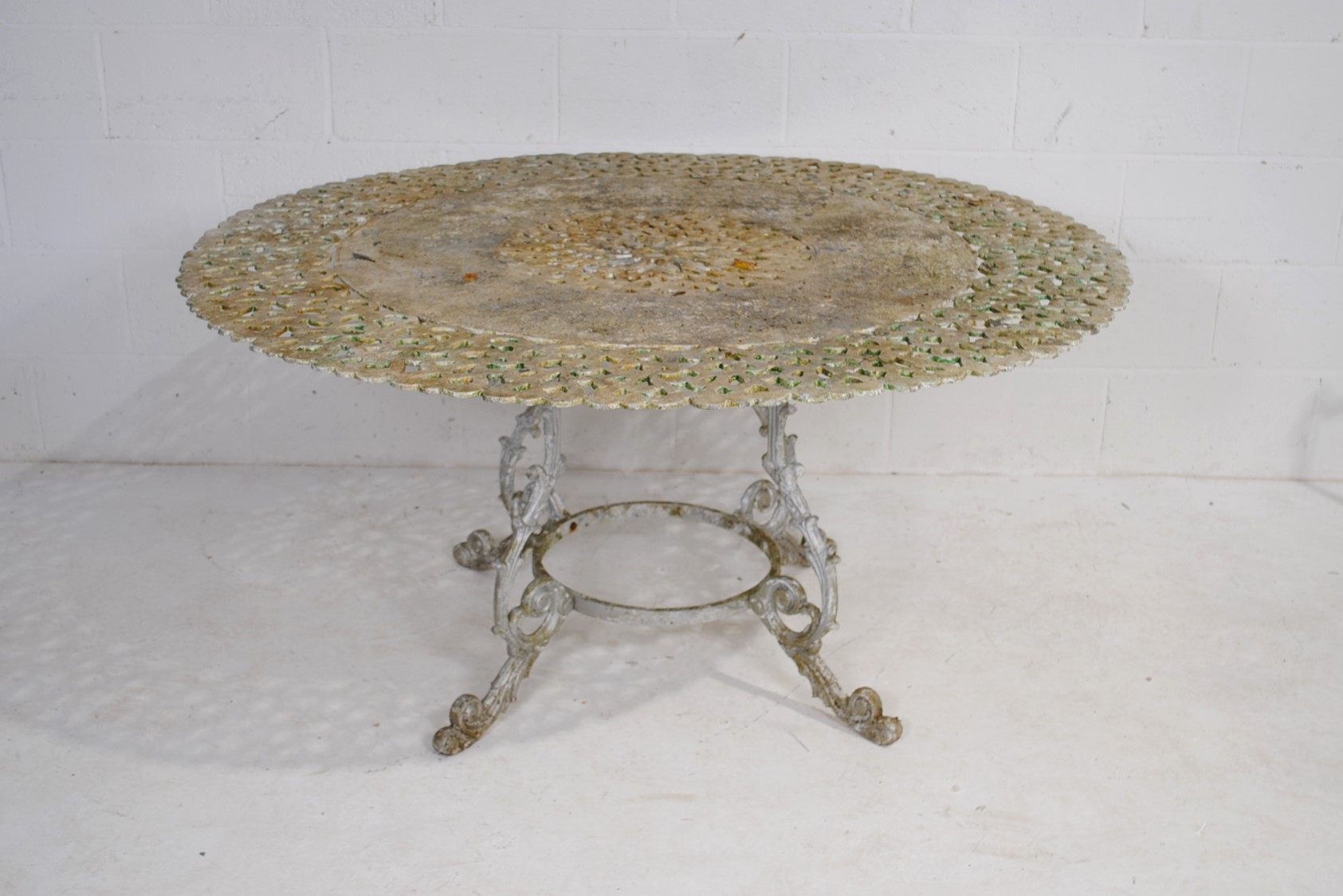 A weathered cast aluminium circular garden table with a set of eight chairs, with lyre backs - one - Image 5 of 12