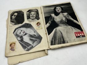 An early 20th century scrap book with numerous film stars, postcards with facsimile signatures etc.