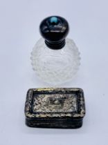 A small Georgian hallmarked silver vinaigrette along with a miniature cut glass scent bottle with