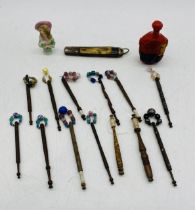 A collection of vintage lace bobbins, along with a Chinese scent bottle, pocket knife etc