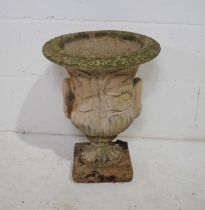 A weathered reconstituted stone garden urn - diameter 37cm, height 46cm