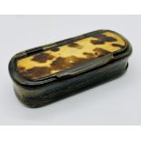 An antique tortoiseshell and horn snuff box