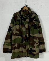 An assortment of DPM camouflage clothing, two jackets and two sets of trousers.