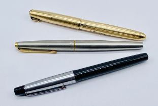Three vintage pens, two Parker pens along with a Varsity Pressmatic