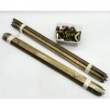 A collection of brass stair rods and brackets