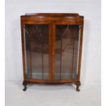 A bow-fronted mahogany display cabinet, raised on cabriole legs - length 91cm, depth 32cm, height