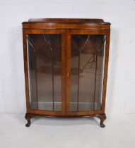 A bow-fronted mahogany display cabinet, raised on cabriole legs - length 91cm, depth 32cm, height