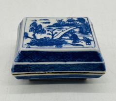 A small Chinese blue and white lidded rectangular pot with six character marks to underside