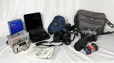 A collection of vintage cameras and lenses including Polaroid, Nikon, Sigma, Praktica etc.