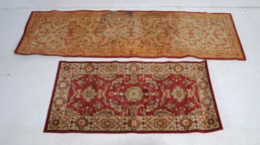 A 'Keshan Supreme' New Zealand wool red ground Eastern rug (70cm x 140cm), along with a Laura Ashley