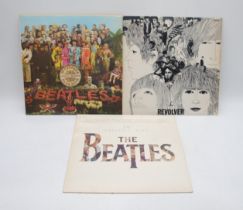 Three 12" vinyl record albums by The Beatles, comprising of 'Sgt. Pepper's Lonely Hearts Club