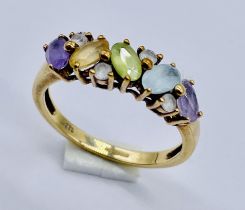 A 9ct gold dress ring set with various coloured gemstones, size P