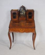 A turn of the century Harding and Sons walnut veneered ladies writing desk, with inlaid detailing,