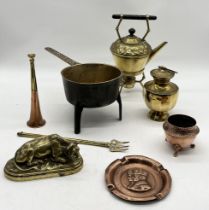 A collection of brass and copper including brass study of a cow, heavy pan on tripod legs by