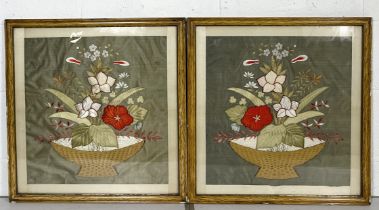 A pair of framed embroideries showing a bouquet of flowers
