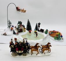 A collection of boxed animated Lemax Christmas village/village collection scenes including flying