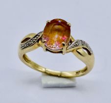 A topaz and diamond ring set in 9ct gold, size P