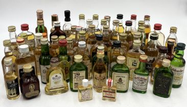 A large collection of whisky miniatures including Canadian Club, Black Grouse, Macallan, Johnnie