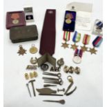 A collection of military awards and badges etc. including WWI and WWII medals, Artic Star, Russian