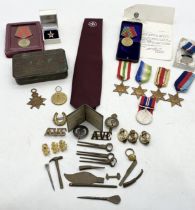 A collection of military awards and badges etc. including WWI and WWII medals, Artic Star, Russian