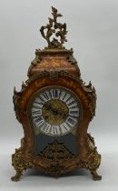 An ornate 20th century Franz Herle & Sons mantle clock with marquetry style detailing, brass mounts,