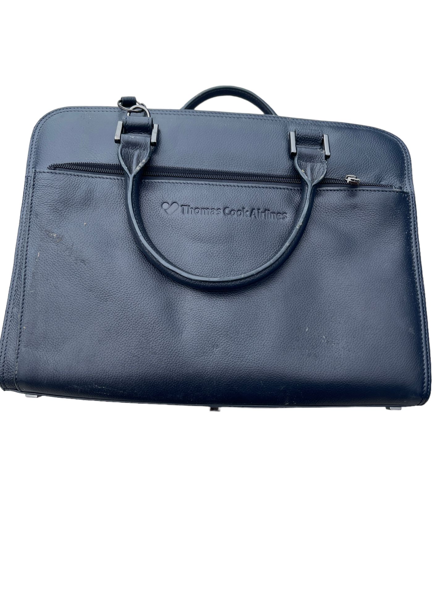 Unclaimed crew luggage bag with contents of Thomson Airways leather