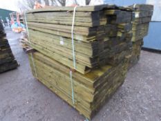 2 X LARGE PACKS OF TREATED FEATHER EDGE TIMBER: MIXED 1.75-1.8M LENGTH APPROX @ 100MM WIDTH APPROX.