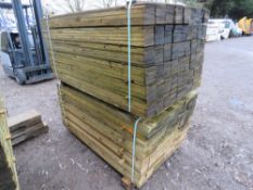 STACK OF TREATED FEATHER EDGE TIMBER: 2 X LARGE PACKS @ 1.5M LENGTH 100MM WIDTH APPROX.