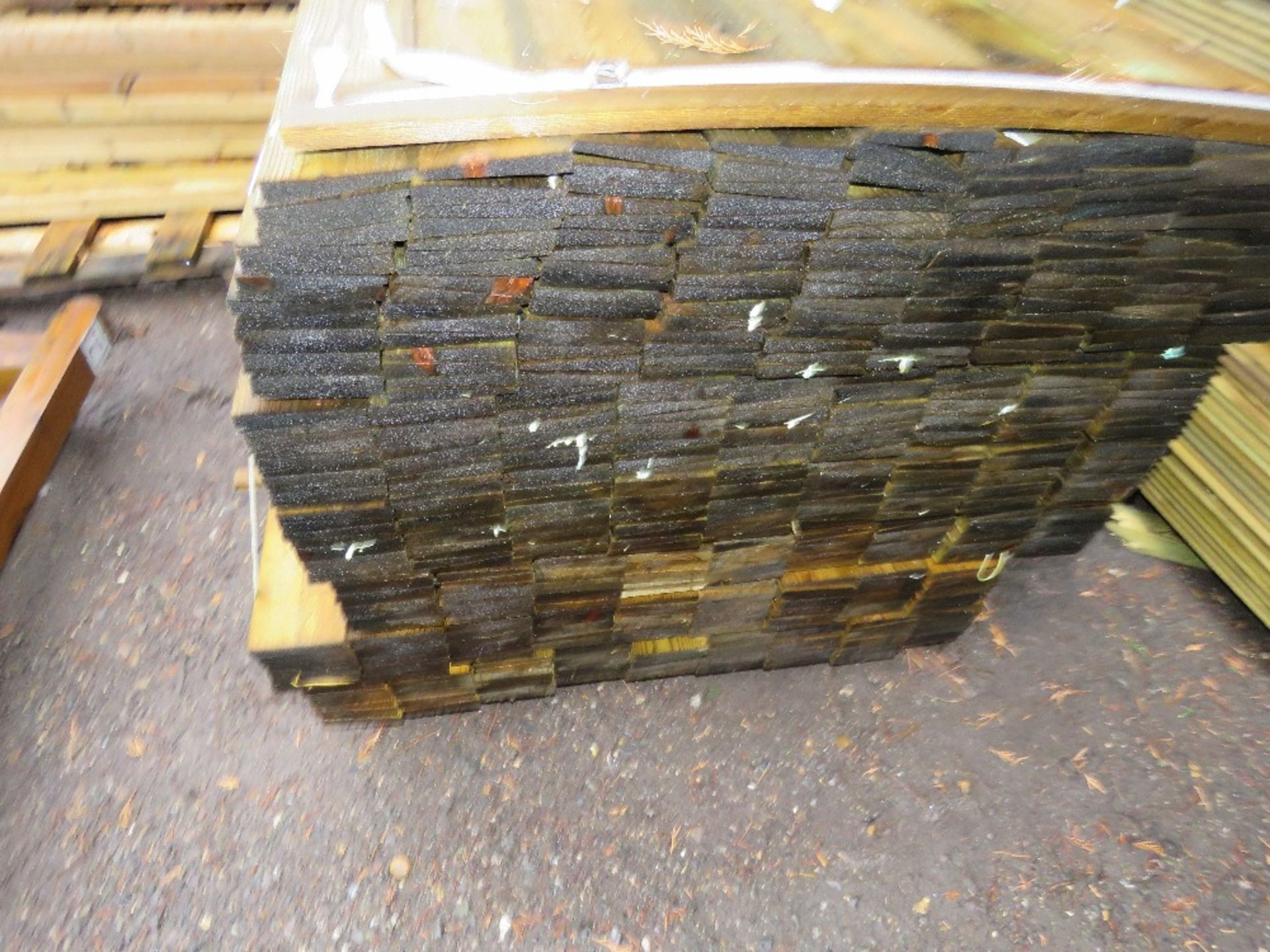 1 X LARGE PACK OF TREATED FEATHER EDGE TIMBER: 1.05M LENGTH APPROX @ 100MM WIDTH APPROX. - Image 2 of 3
