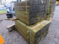 STACK OF TREATED FEATHER EDGE TIMBER: 2 X LARGE PACKS @ 1.2M AND 1.65M LENGTH 100MM WIDTH APPROX.