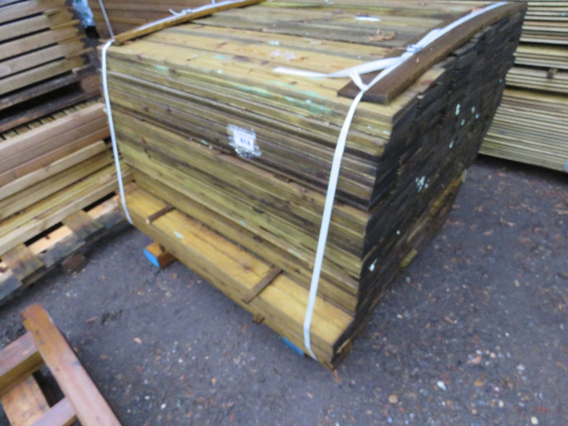1 X LARGE PACK OF TREATED FEATHER EDGE TIMBER: 1.05M LENGTH APPROX @ 100MM WIDTH APPROX.