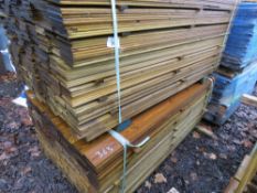 2 X LARGE PACKS OF TREATED HIT AND MISS TIMBER CLADDING BOARDS. 1.75M LENGTH X 95MM WIDTH APPROX.