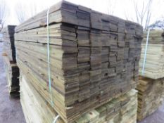 2 X LARGE PACKS OF TREATED FEATHER EDGE TIMBER CLADDING BOARDS: 1.80M LENGTH X 100MM WIDTH APPROX.