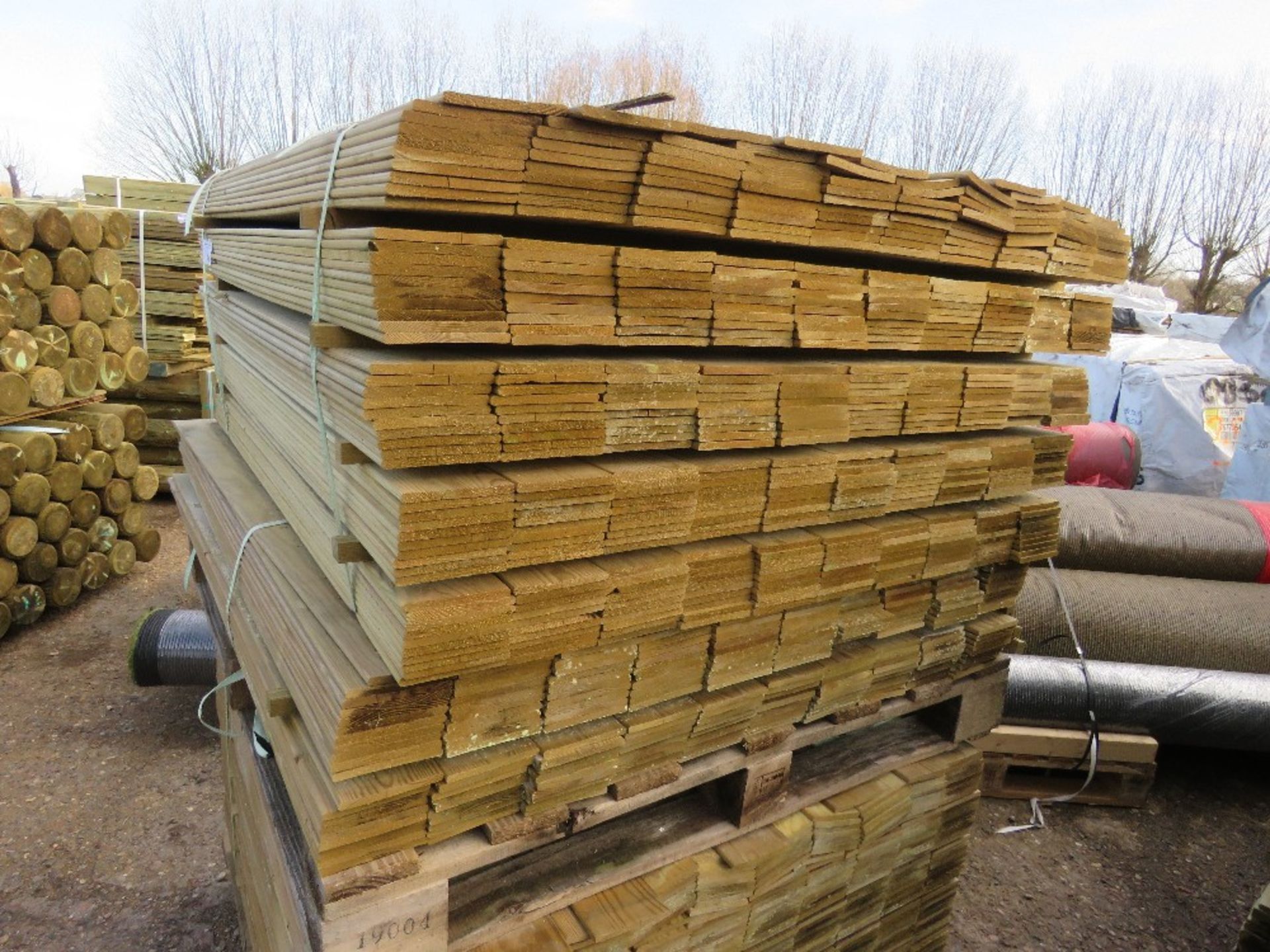 2 X PACKS OF TREATED HIT AND MISS CLADDING BOARDS 114CM LENGTH X 100MM WIDTH APPROX. - Image 2 of 4