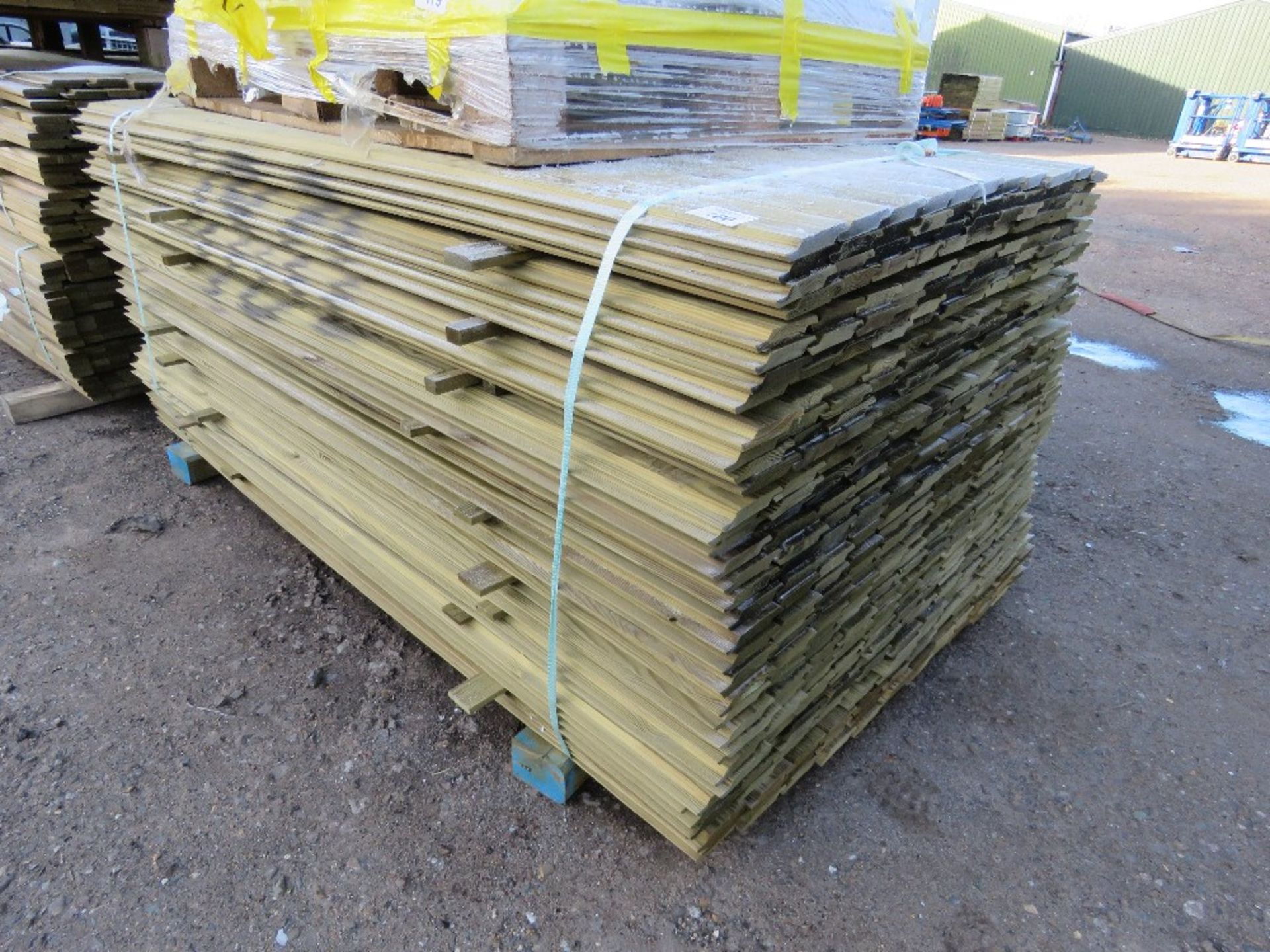 LARGE PACK OF PRESSURE TREATED SHIPLAP FENCE CLADDING BOARDS. 1.73M LENGTH X 100MM WIDTH APPROX.