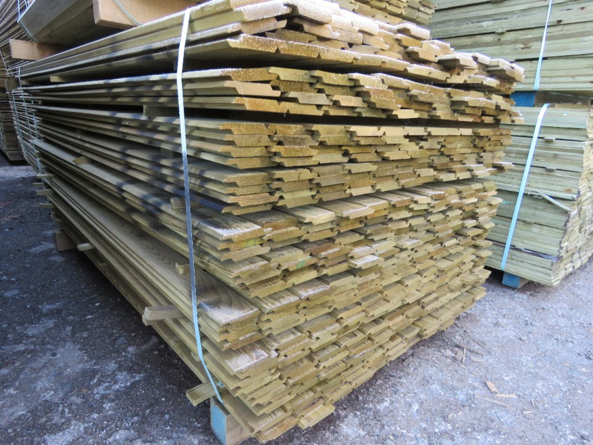 LARGE PACK OF PRESSURE TREATED SHIPLAP FENCE CLADDING BOARDS. 1.83M LENGTH X 100MM WIDTH APPROX.