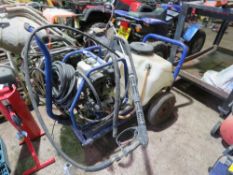 HONDA POWERED PRESSURE WASHER UNIT WITH A TANK ON A BARROW. THIS LOT IS SOLD UNDER THE AUCTIONEERS