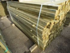 LARGE PACK OF CHAMFERED PROFILE PRESSURE TREATED TIMBER BATTENS. 1.83M LENGTH X 70MM WIDTH MAX X 35M