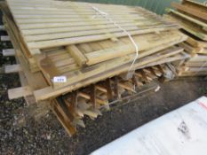 STACK OF ASSORTED SMALL SIZED WOODEN FENCE PANELS PLUS GATES.