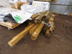 PALLET OF ASSORTED TREATED POSTS AND TIMBERS.