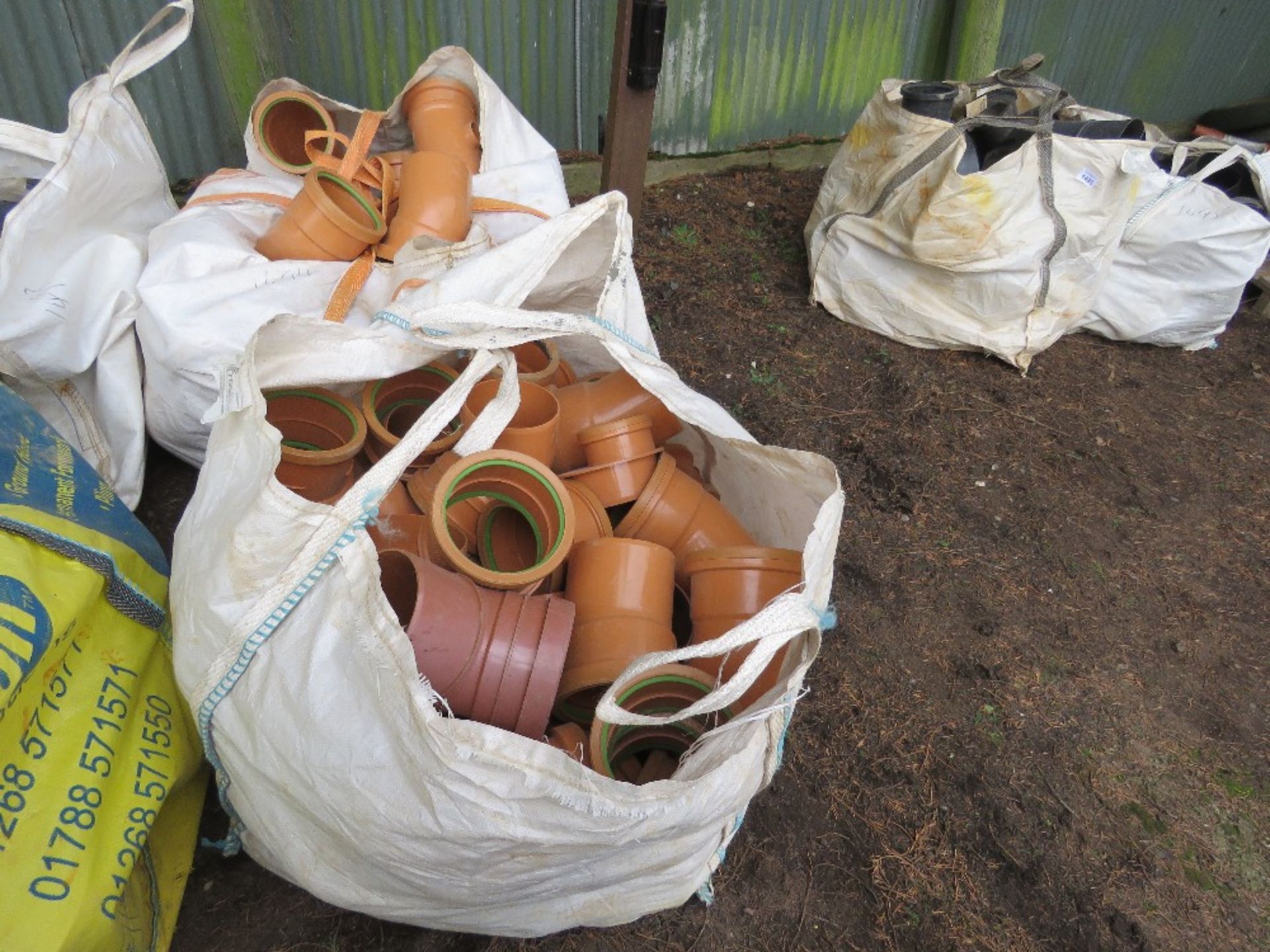 2 X BULK BAGS CONTAINING ASSORTED ORANGE PLASTIC DRAINAGE FITTINGS MAINLY 160MM. DIRECT FROM COMPANY