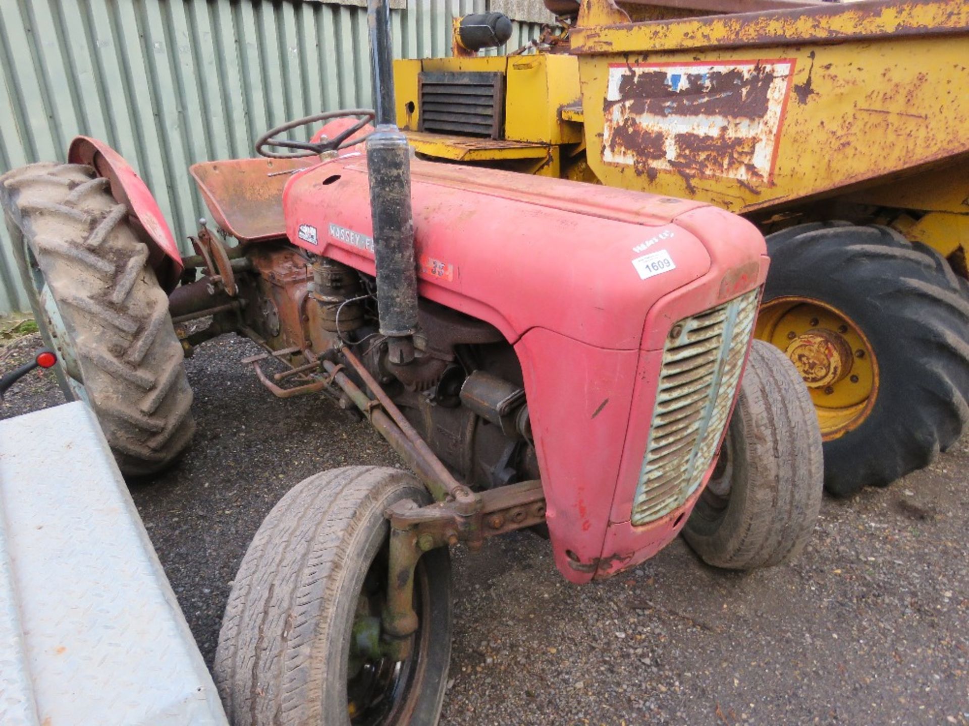 MASSEY FERGUSON 35 4 CYLINDER TRACTOR. BRIEF TESTING BY PUSHING SAW THE ENGINE TURN OVER AND TRY TO