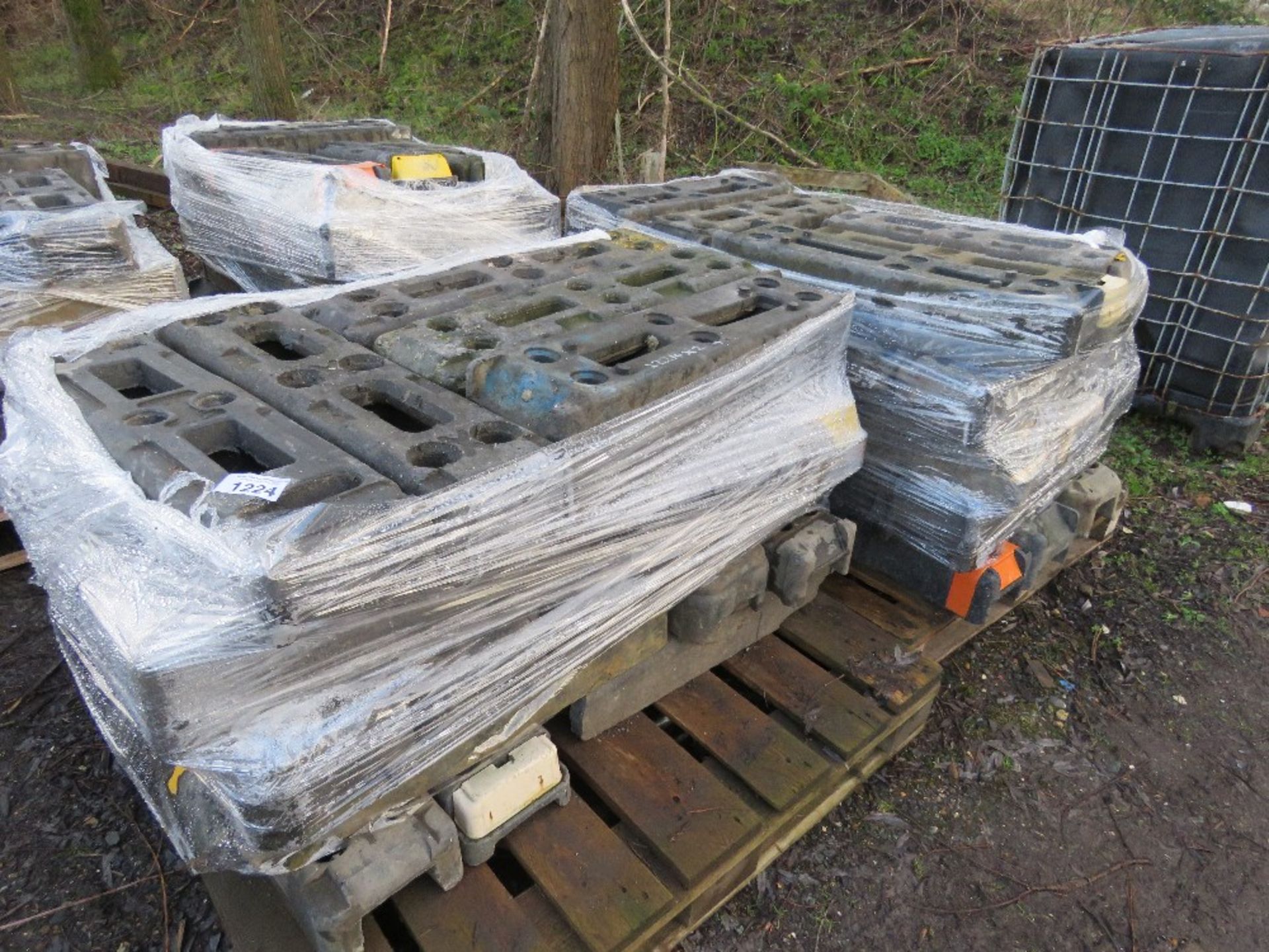 2 X PALLETS OF HERAS TYPE TEMPORARY FENCE BASES / FEET. THIS LOT IS SOLD UNDER THE AUCTIONEERS MA