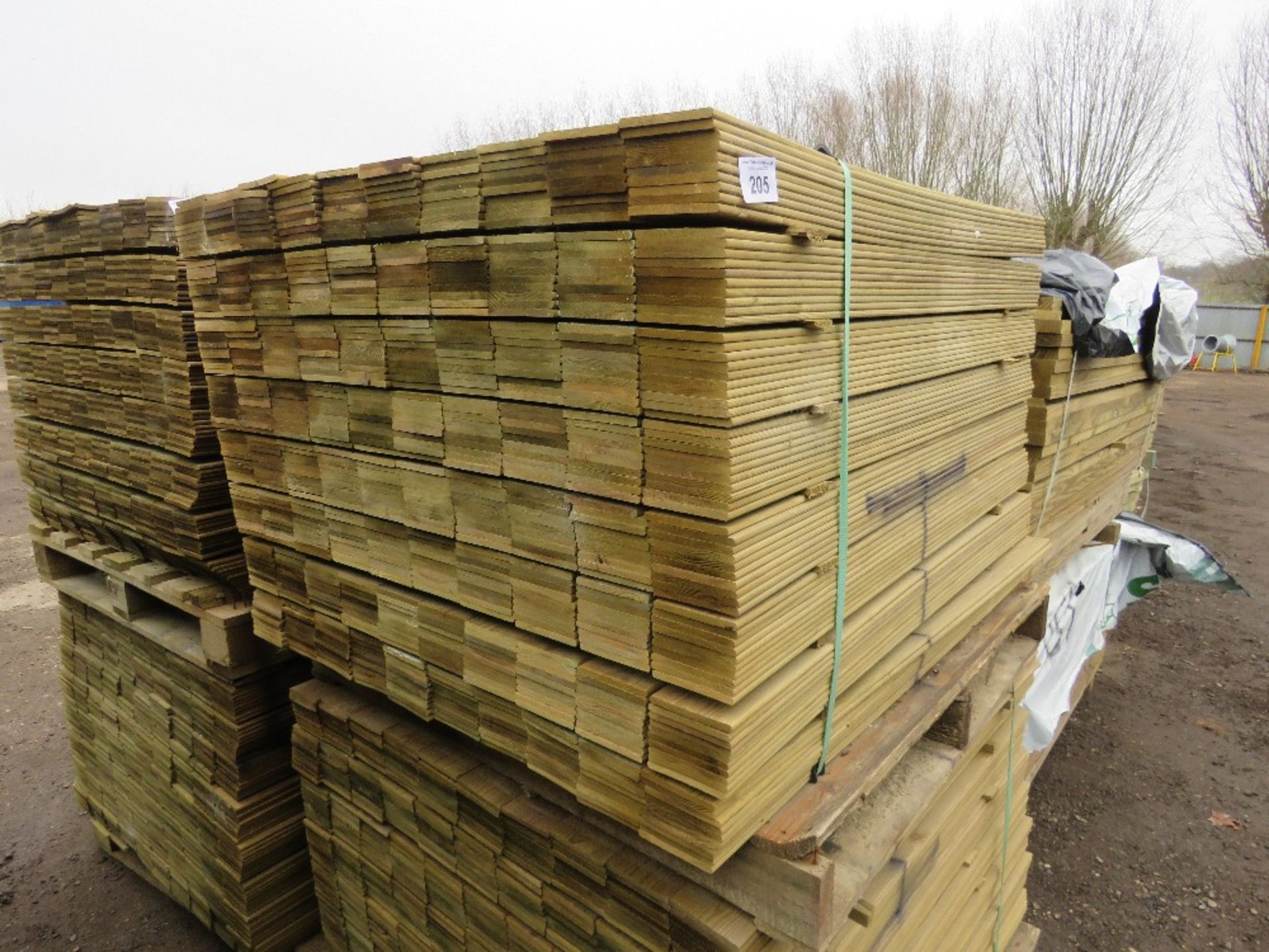 2 X PALLETS OF TREATED HIT AND MISS FENCE CLADDING BOARDS 1.04M LENGTH X 100MM WIDTH APPROX.