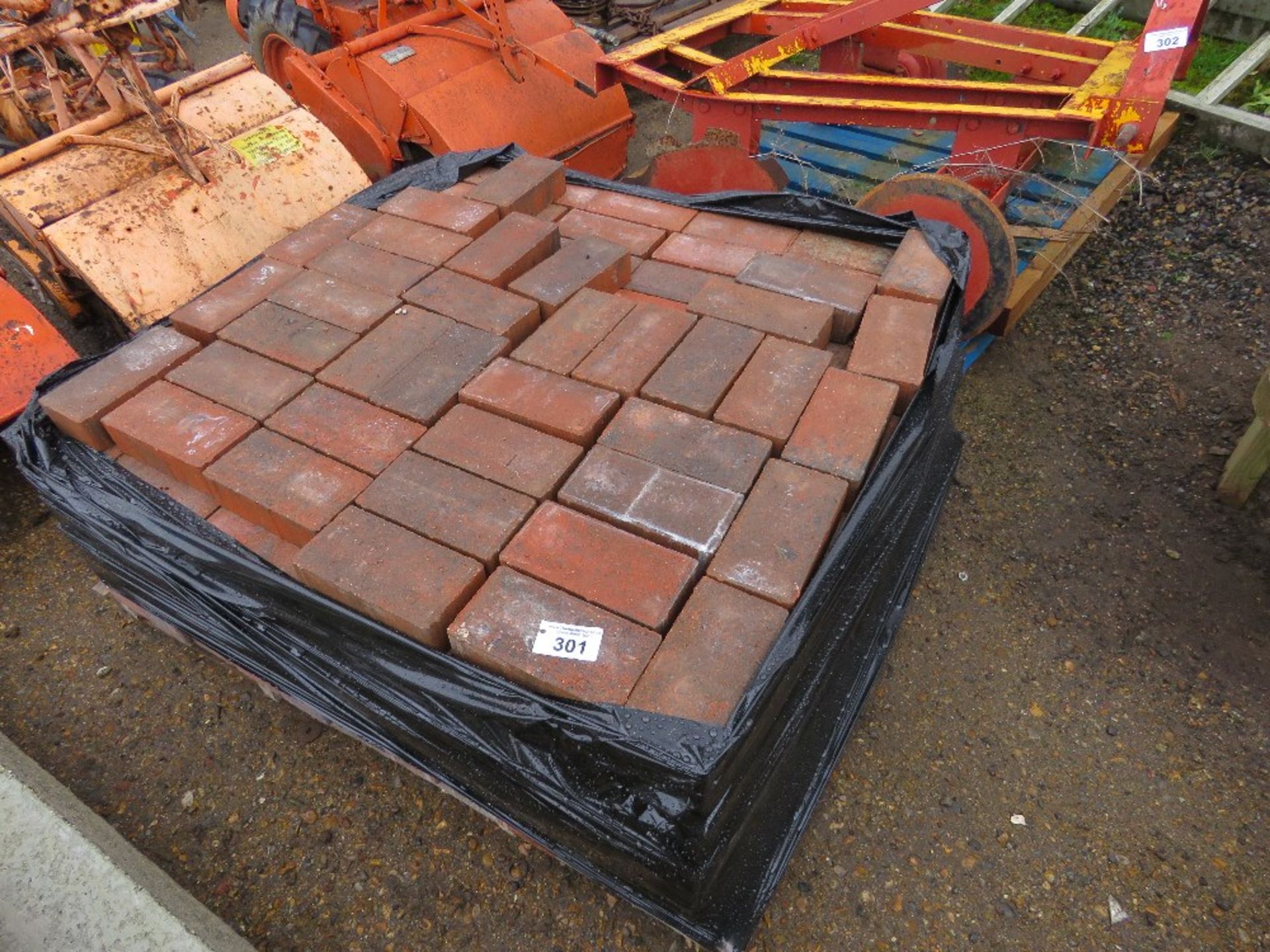 PALLET OF RED PAVERS.