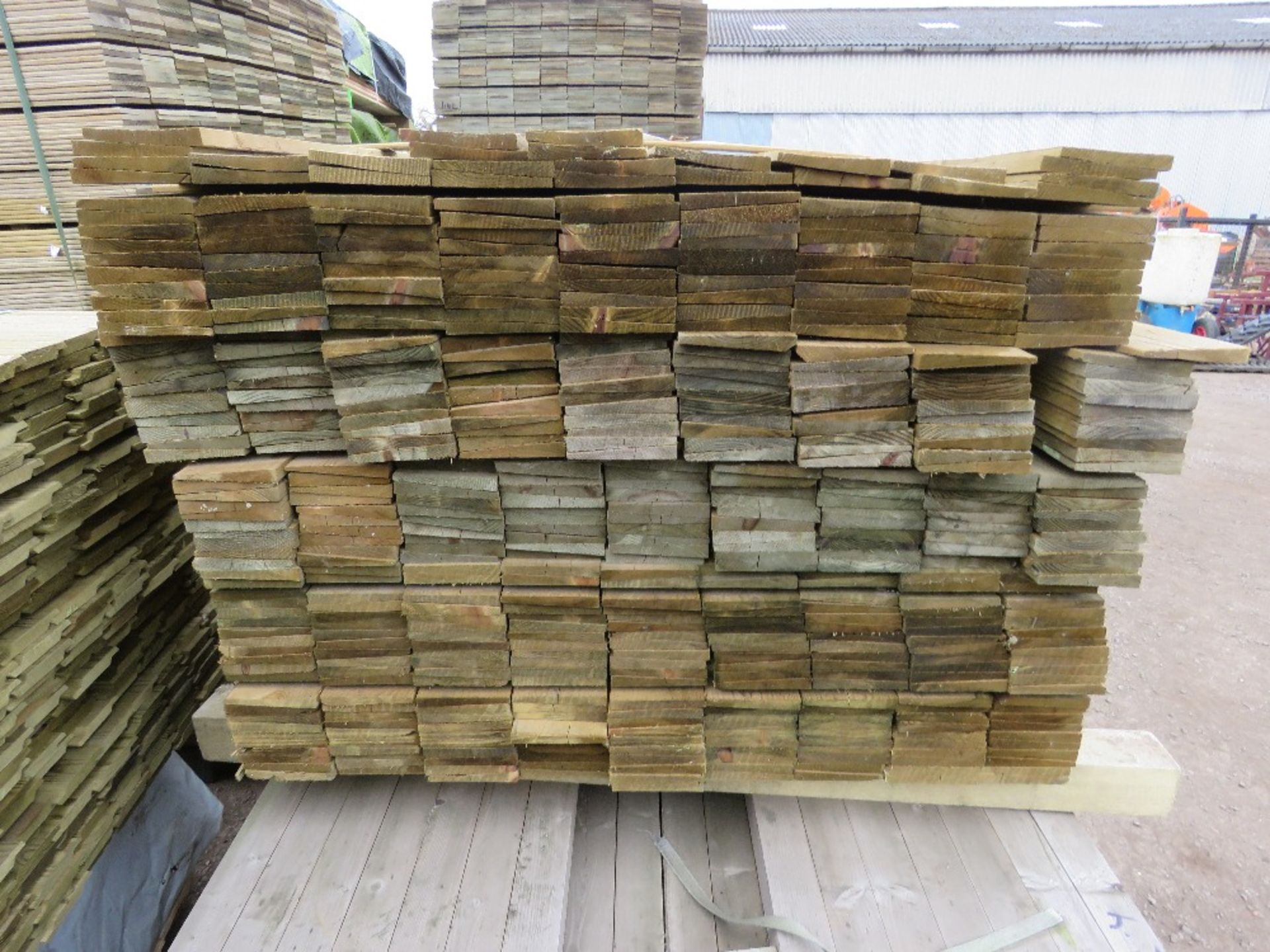 LARGE PACK OF TREATED FEATHER EDGE TIMBER CLADDING BOARDS 1.35M LENGTH X 100MM WIDTH APPROX. - Image 2 of 3